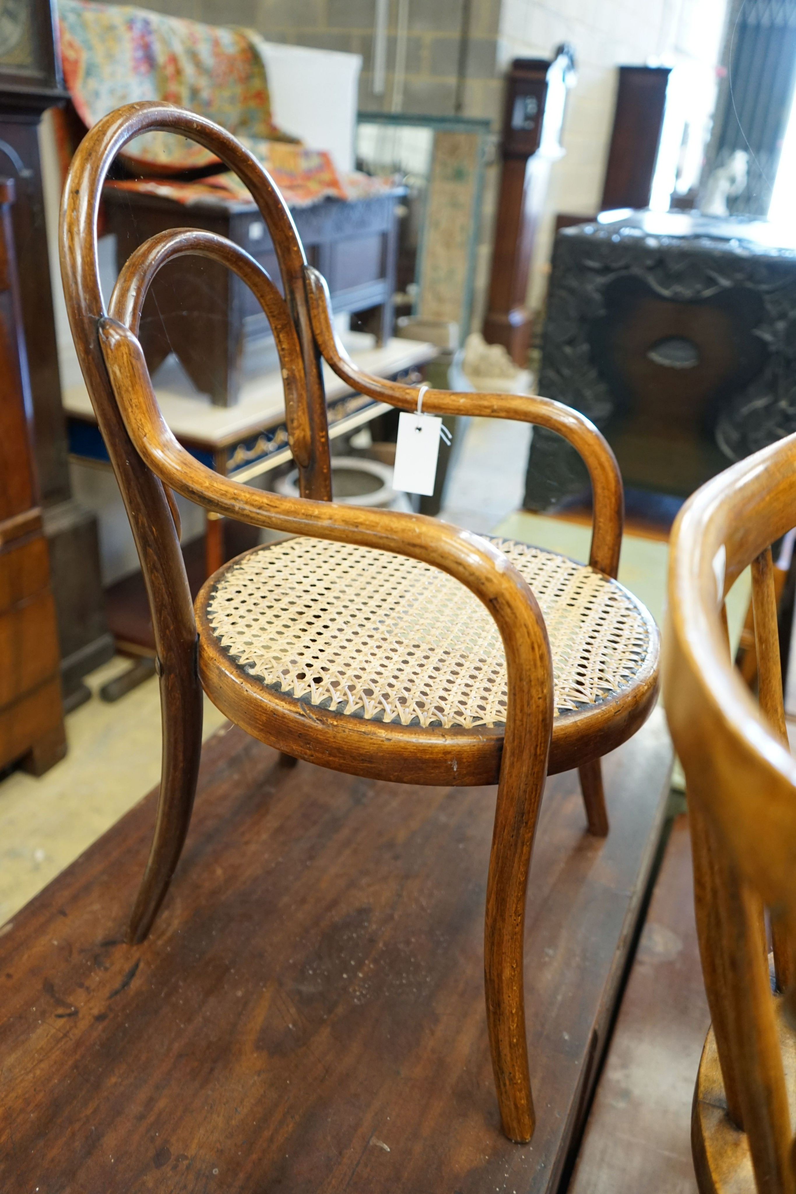 Two early 20th century childs' beach cane seat bentwood chairs and a child's Windsor chair